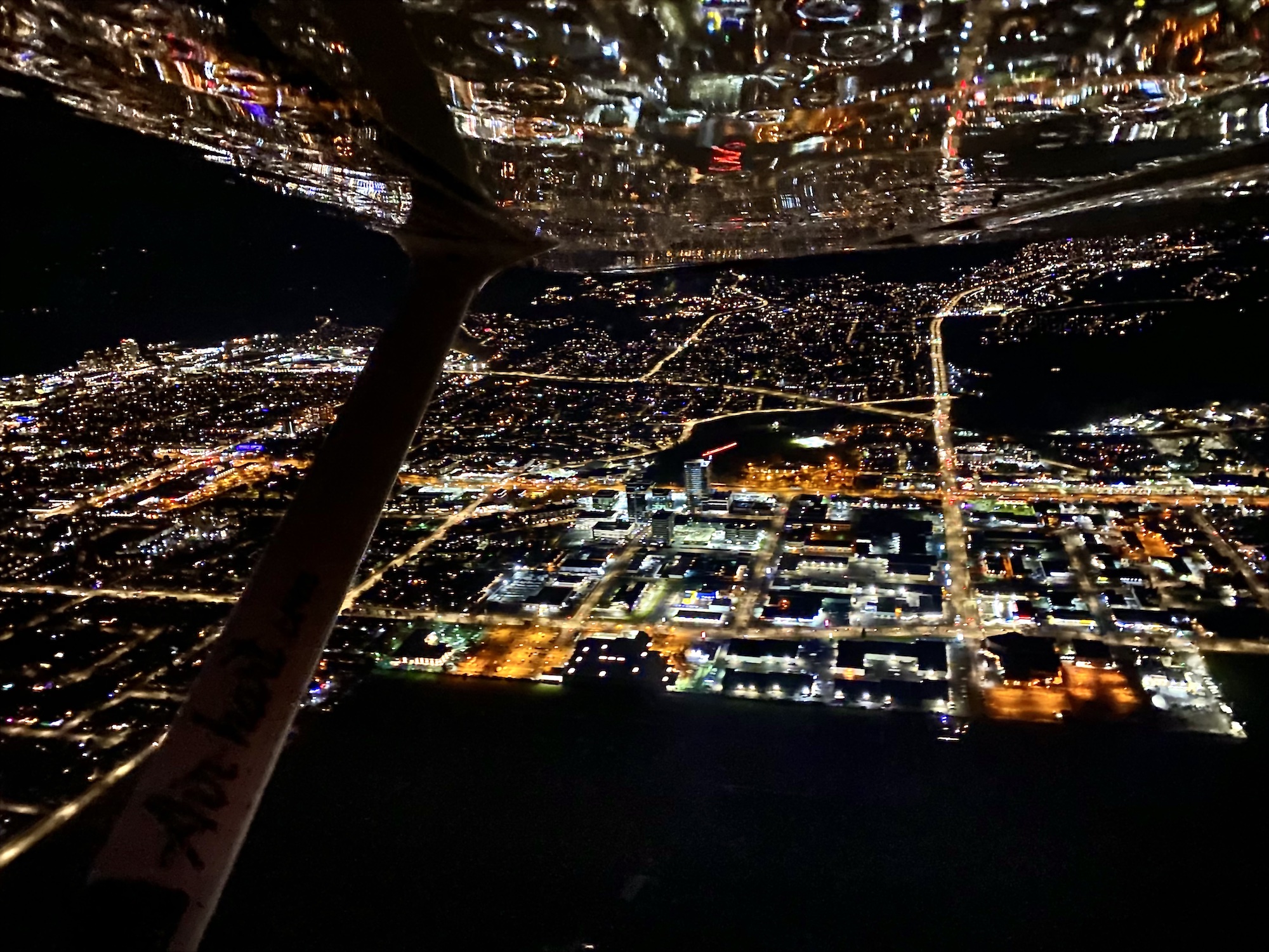 View of city at night from float plane